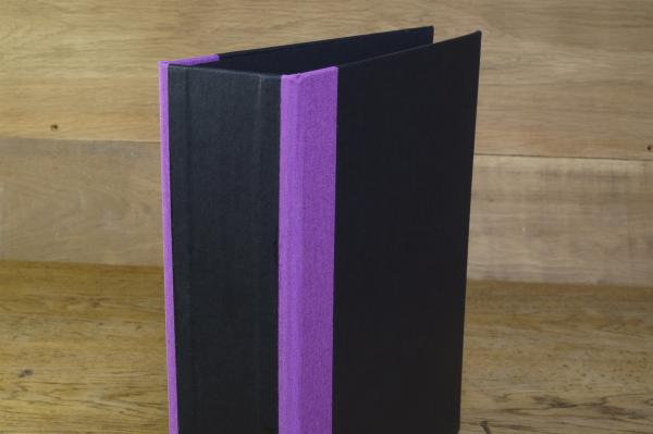 black folder with purple linen edges